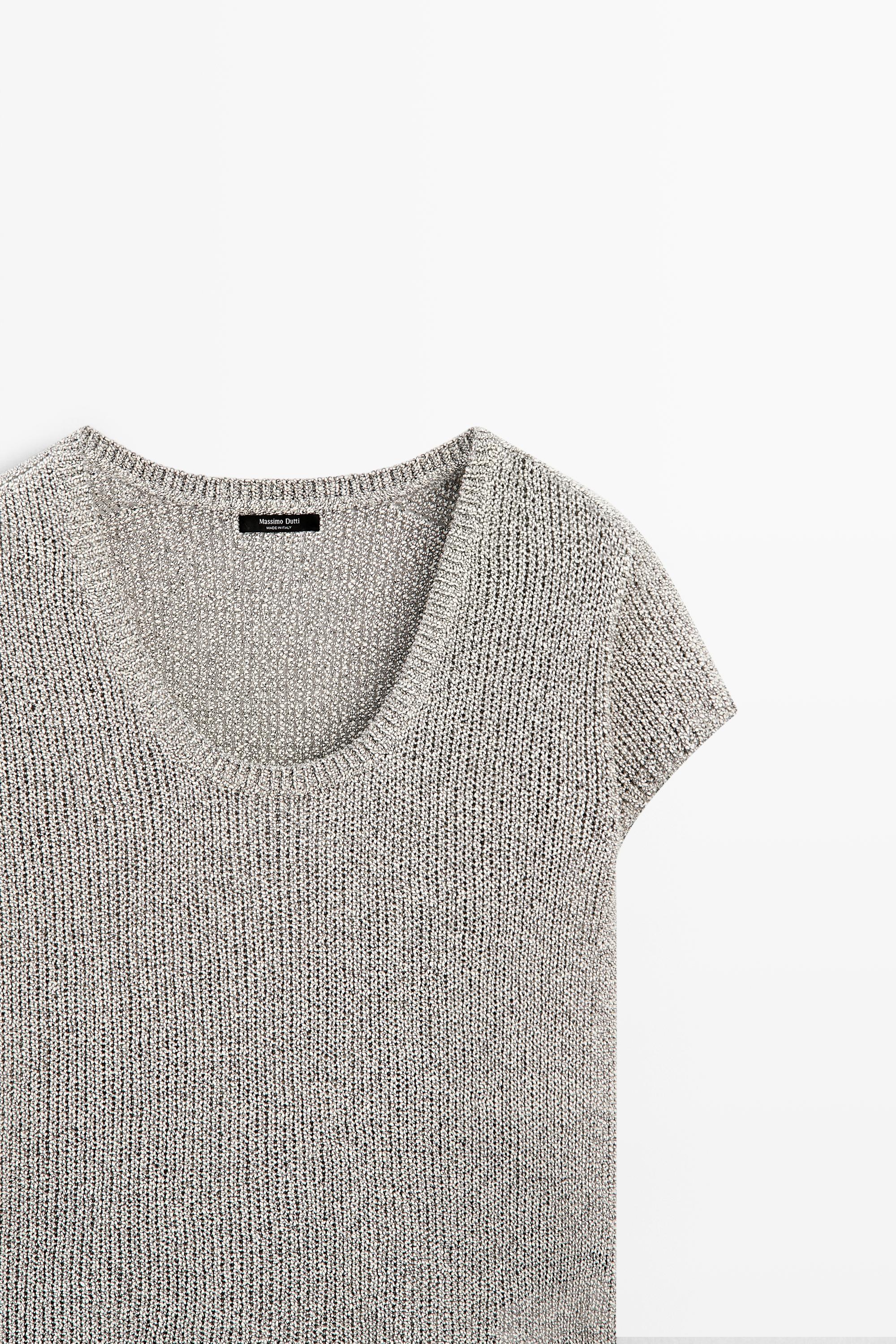 Short sleeve knit sweater with thread detail